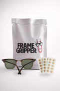 a white bag with sunglasses and a pair of glasses
